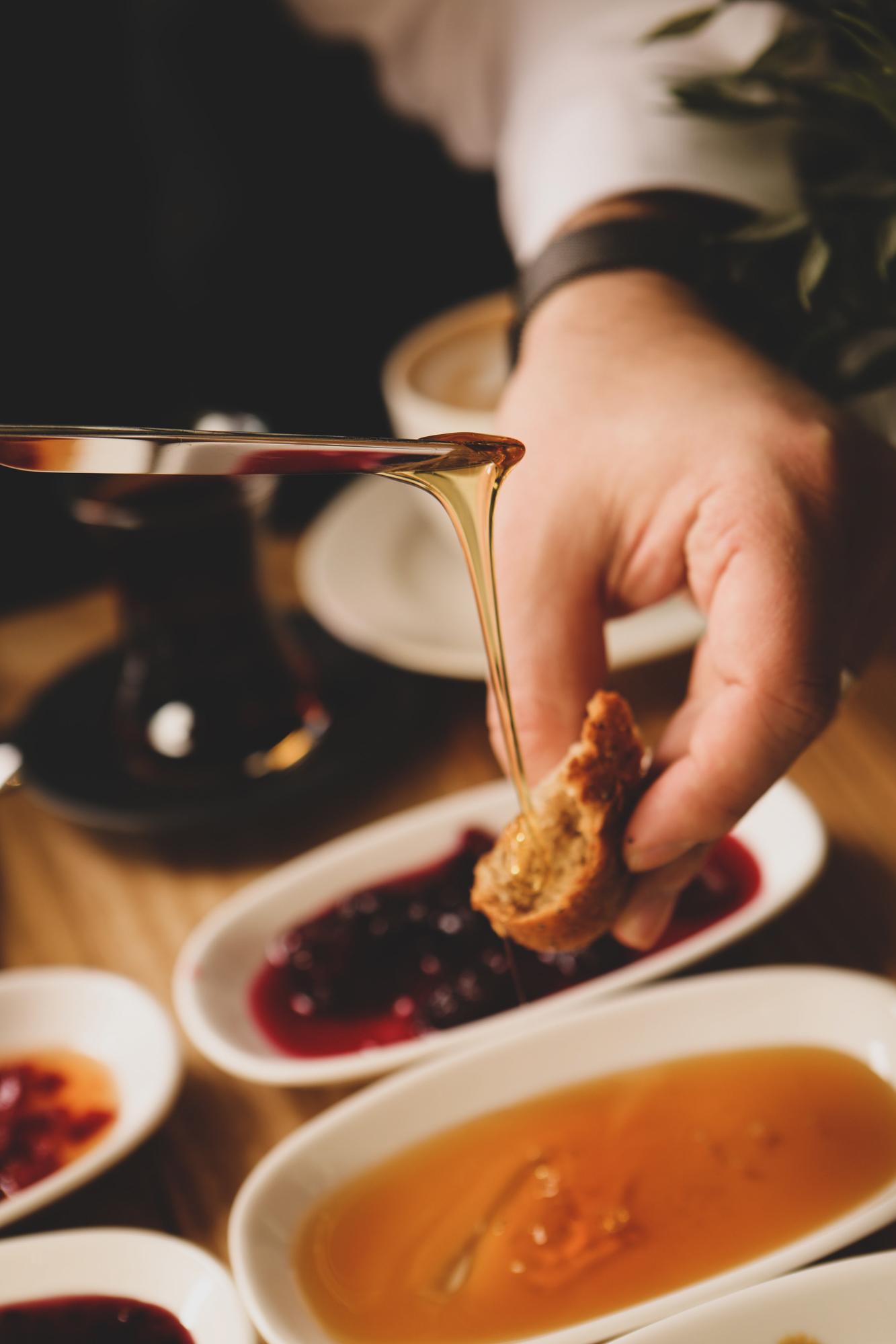 Founder in studio tasting a sauce