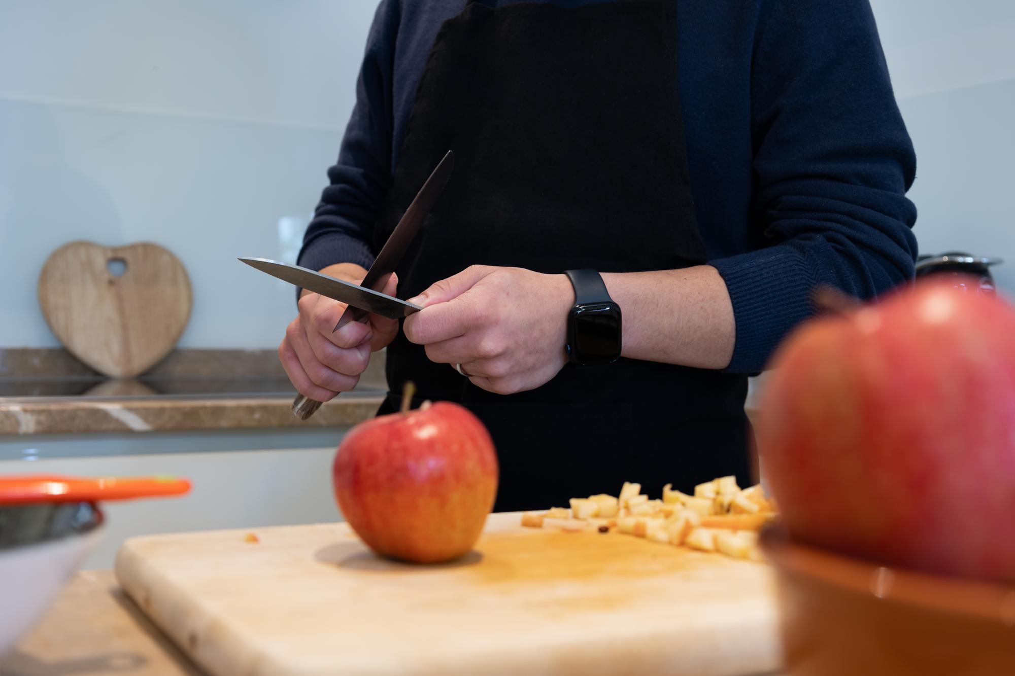 Instructor demonstrating knife technique to a small group